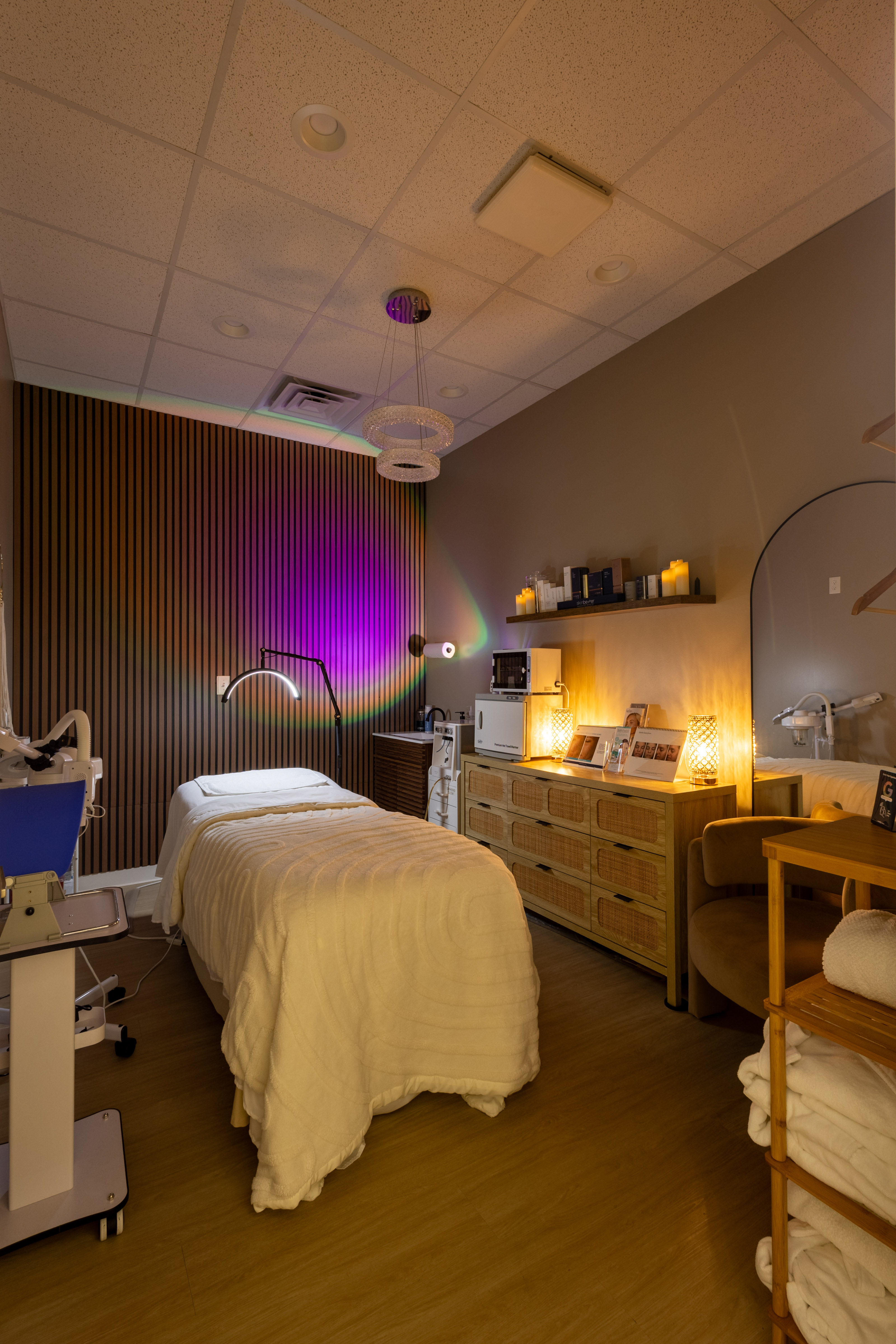 Treatment room with ambient lighting and medical equipment